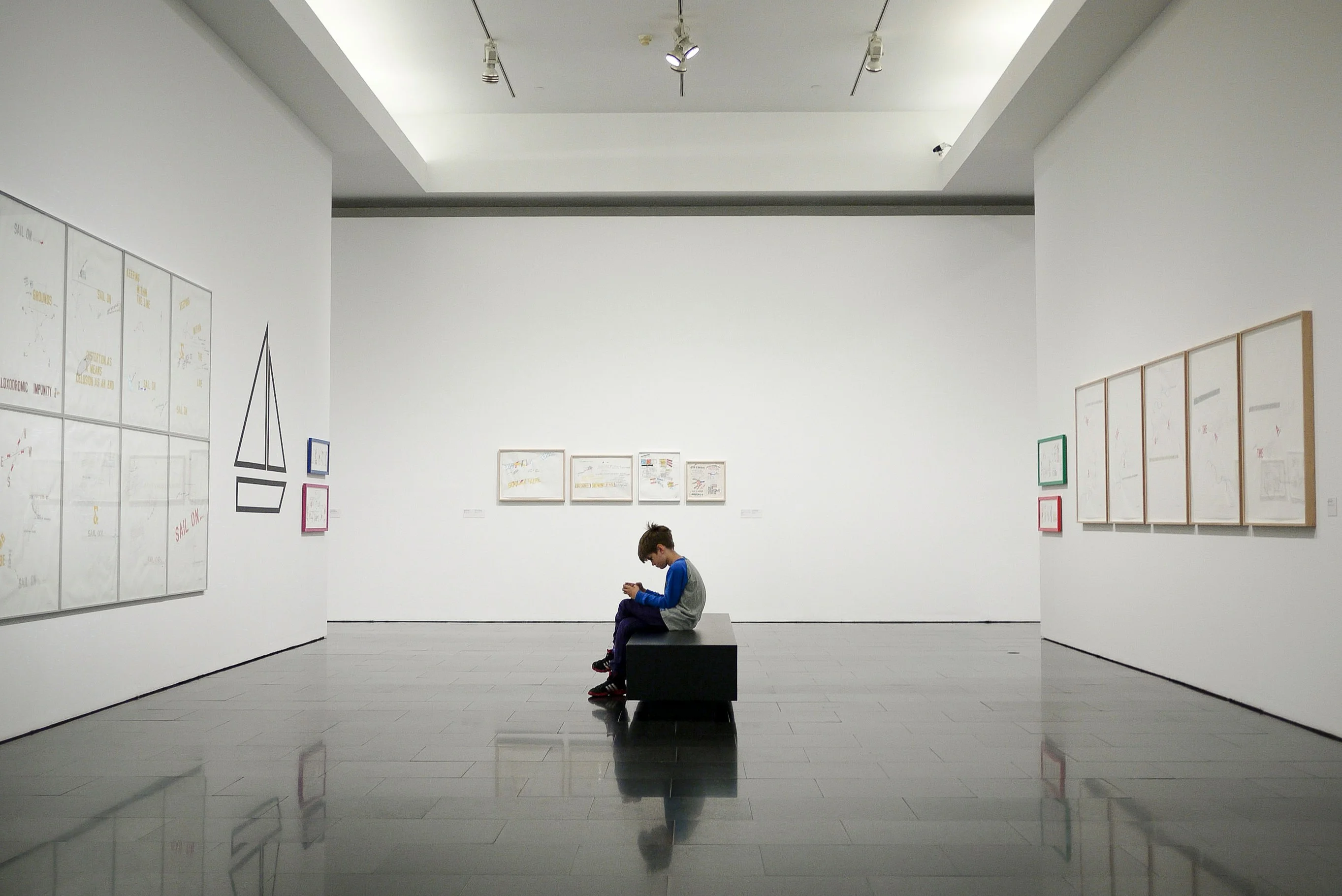 Visitor engaged with exhibit while using audio guide